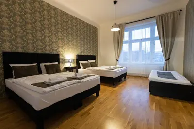 a bedroom with two beds and a window at OLD TOWN SPIRIT in Prague