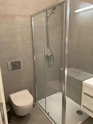 a bathroom with a shower with a toilet and a sink at OLD TOWN SPIRIT in Prague