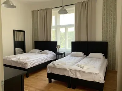 a bedroom with two beds and a window at OLD TOWN SPIRIT in Prague