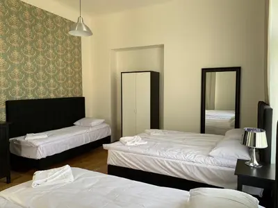 a hotel room with two beds and two mirrors at OLD TOWN SPIRIT in Prague