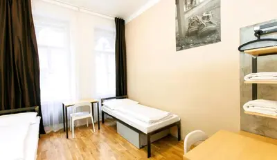 a small room with a bench and a window at Czech Inn in Prague