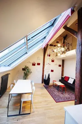 a room with a table and chairs in a building at Czech Inn in Prague