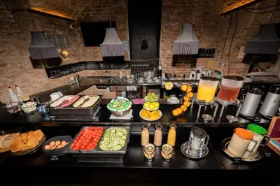 a buffet line with different types of food and drinks at Czech Inn in Prague