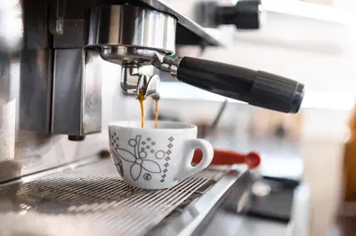 a coffee maker is making a cup of coffee at Sophie's Hostel in Prague