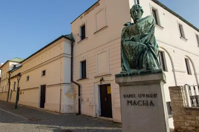a statue of a woman in front of a building at Apartmán U Gotického dvojčete in Litoměřice