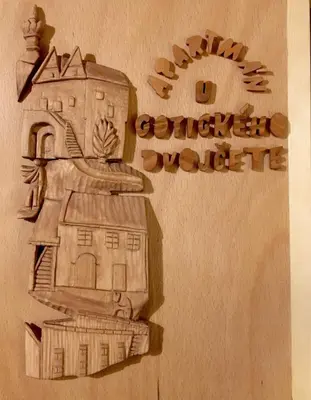 a drawing of a building on the side of a wall at Apartmán U Gotického dvojčete in Litoměřice
