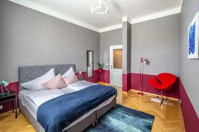 a living room with a couch and a table at Garden Apartments in Prague