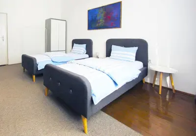 two beds sitting in a room with at Václavkova Apartment in Mladá Boleslav