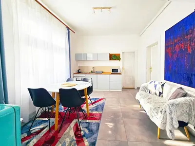a living room with a table and a couch at Václavkova Apartment in Mladá Boleslav
