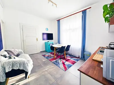 a living room with a table and chairs in it at Václavkova Apartment in Mladá Boleslav