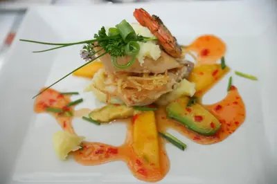 a plate of food with a piece of meat and vegetables at Nebozizek Hotel a Restaurant in Prague