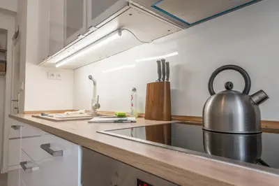 a kitchen with a large pot on the counter at Quiet apartment in the city center with own terrace in Prague