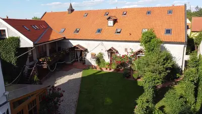 an aerial view of a house with a yard at Penzion u Svatého Prokopa in Středokluky