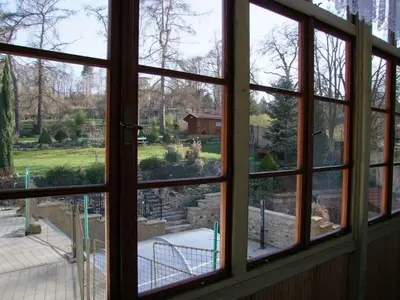 a window view of a garden from a house at Apartmán pod rozhlednou in Roudnice nad Labem