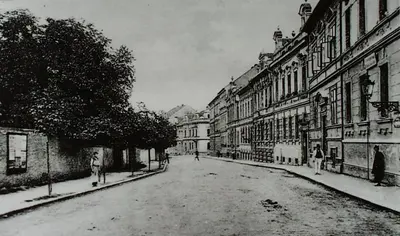 a black and white photo of a street with buildings at Apartmán pod rozhlednou in Roudnice nad Labem