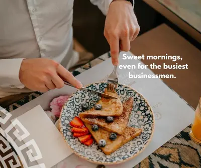 a person reaching for a plate of food on a table at Hotel Galatea in Mladá Boleslav