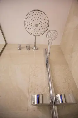 a shower with a shower head in a bathroom at Hotel Galatea in Mladá Boleslav