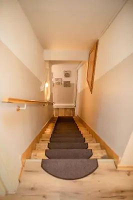 a staircase in a house with a rug at Central 3bdr penthouse with terrace&AC in Prague