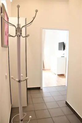 a candle holder in a room with a hallway at Flowers apartments in Prague