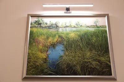 a painting of a pond in a field of grass at Flowers apartments in Prague