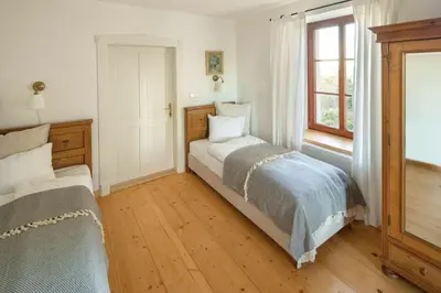 a bedroom with a bed and a window at Vikendovka Korce in Dubá