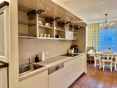 a kitchen with a sink and a table at Unique Charles Bridge 2BDR Apartment. in Prague