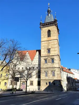 a large building with a clock tower on top of it at Reznicka Apartments in Prague