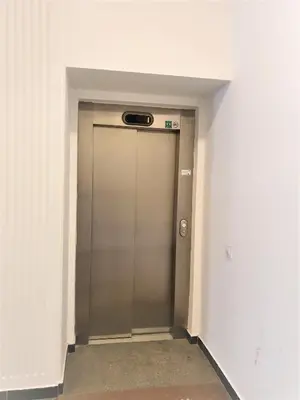 a elevator with a door in a hallway at Reznicka Apartments in Prague