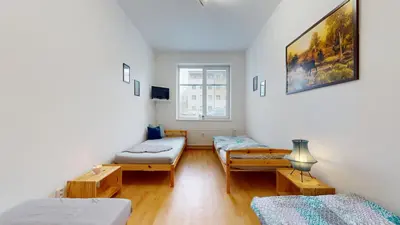 a living room with two beds and a couch at Apartmán Topolová 912B in Milovice