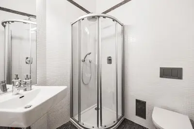 a bathroom with a shower and a sink at COZY QUIET STUDIO AT CHARLES BRIDGE in Prague