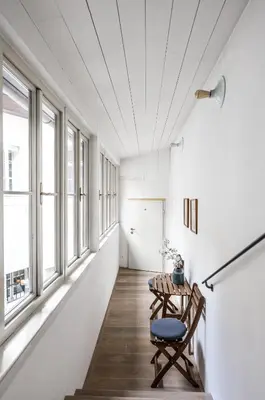a room with a table and chairs and windows at COZY QUIET STUDIO AT CHARLES BRIDGE in Prague