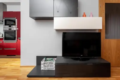 a bedroom with a bed and a table at Prague Days - Two-bedroom Family Apartment with Terrace and Garage in Vinohrady in Prague