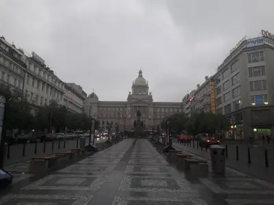 an empty street in front of a large building at Apartman Exclusive Prague in Prague