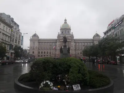 a large building with a statue in front of it at Apartman Exclusive Prague in Prague