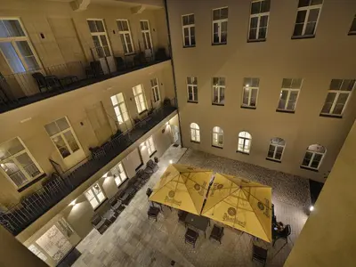 an overhead view of a building with a yellow umbrella at EA Hotel New Town in Prague