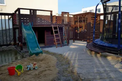 a playground with a swing set and a trampoline at Apartment Rezidence La in Prague
