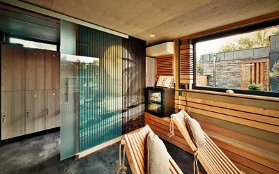 a house with a pool and two chairs and a balcony at Apartment Rezidence La in Prague