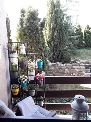 a garden with potted plants on a balcony at Apartment 144 in Kněževes