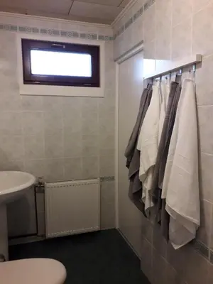 a bathroom with a towel rack and a sink at Apartment 144 in Kněževes