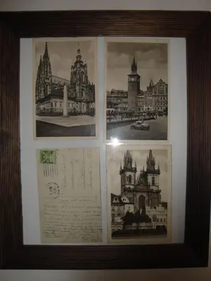 a framed picture of drawings of buildings and documents at Pension Karnet in Prague