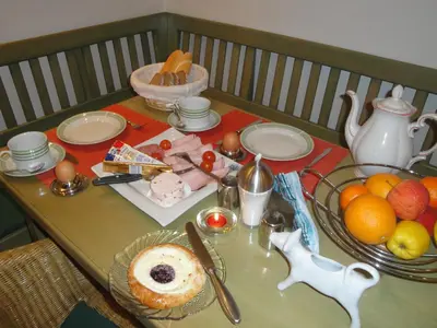 a table with food and fruit on top of it at Pension Apartment Granit in Prague