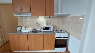 a bedroom with a large bed and a desk and a table at Bonvolon in Prague