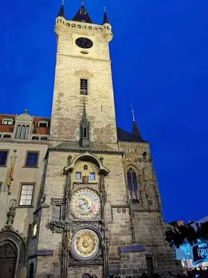 a tall tower with a clock on a building at River Star Hotel in Prague