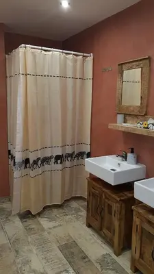 a bathroom with a tub and a toilet and a sink at Hotel Na Hradbách in Louny