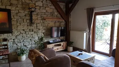 a room with two beds and a tv in it at Hotel Na Hradbách in Louny