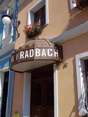 a hotel sign on the side of a building at Hotel Na Hradbách in Louny