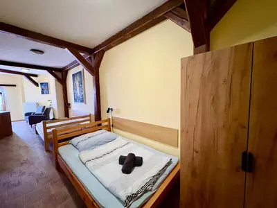 a living room with a couch and a table at Hotel Na Hradbách in Louny
