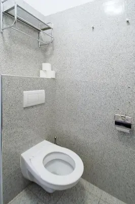 a bathroom with a white toilet in a stall at Modern Apartment Skolska 20 in Prague