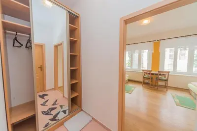 a mirror in a room with a living room at Pension U kostela in Český Brod