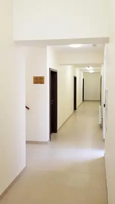 an empty hallway with white walls and doors at Apartment De Luna in Prague